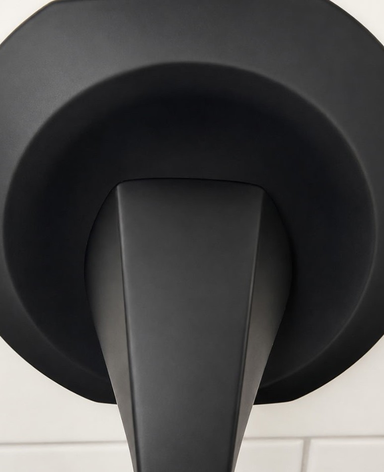 Clean matte black shower handle free of mineral deposits and hard water stains after deep cleaning
