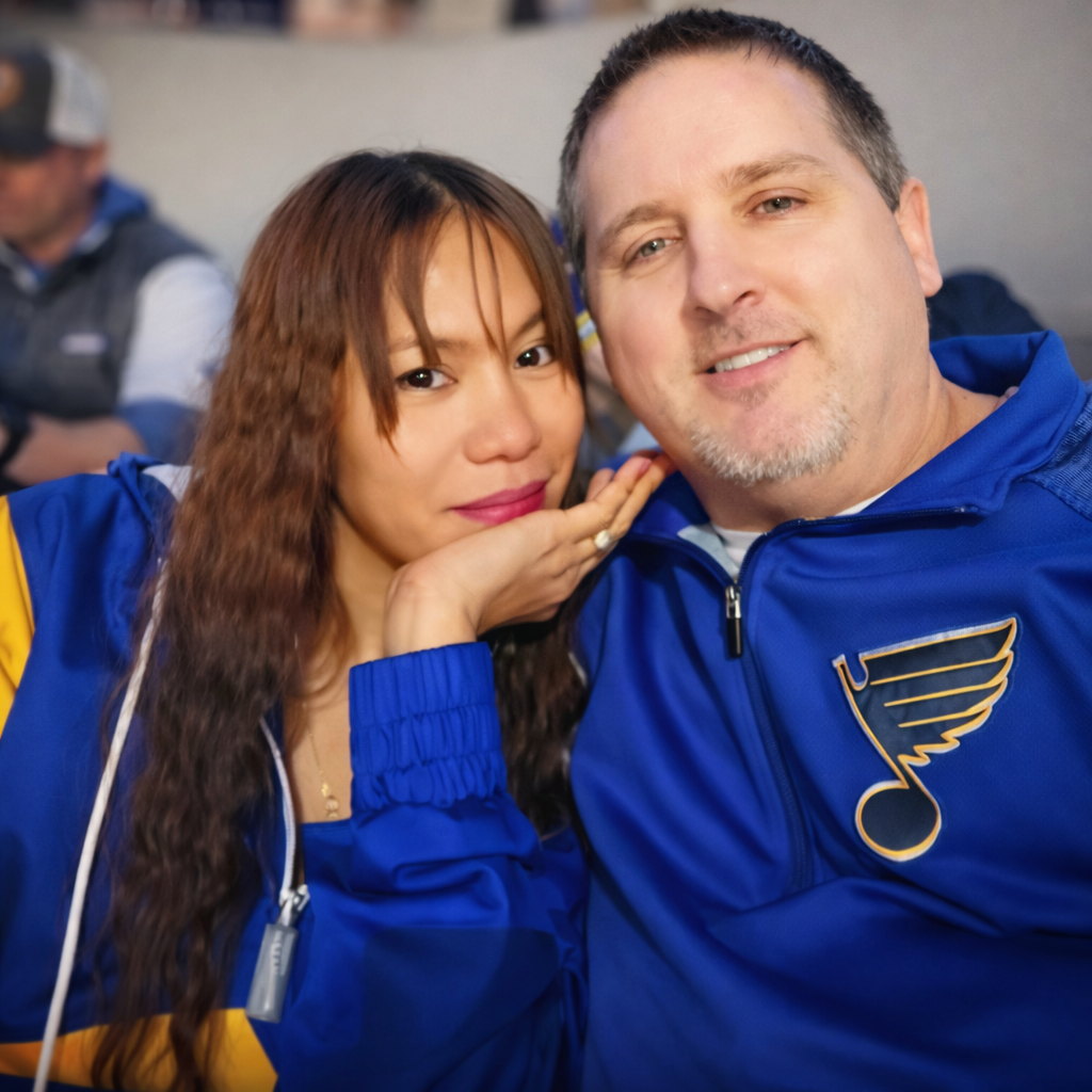 Mrs Sparkle Cleaning Co owners in St. Louis Blues gear