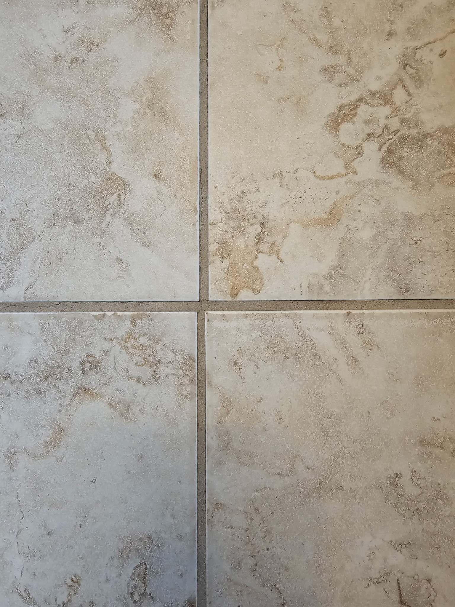 Clean restored tile and grout lines in Affton MO after professional floor cleaning service by Mrs Sparkle Cleaning Co